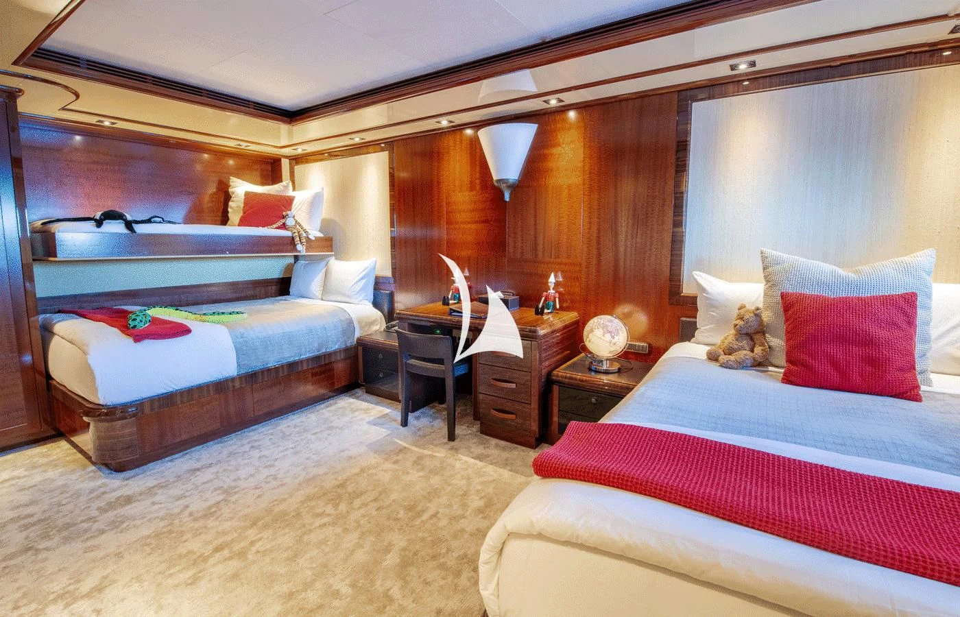 a bedroom with a bed and a desk aboard ARBEMA Yacht for Sale