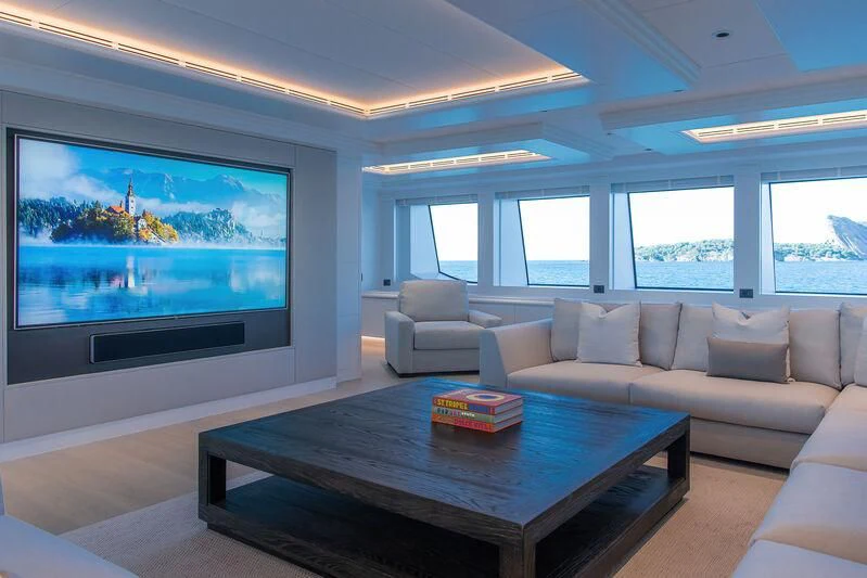 a living room with a large screen aboard ARBEMA Yacht for Sale
