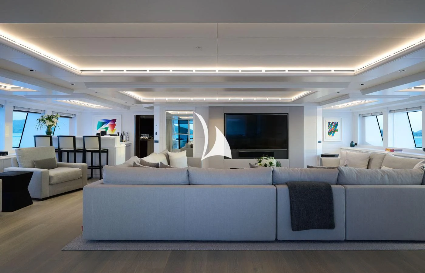 a large living room with a large sofa and a flat screen tv aboard ARBEMA Yacht for Sale
