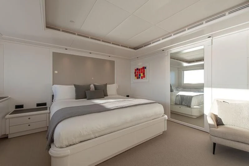 a room with a bed and a chair aboard ARBEMA Yacht for Sale