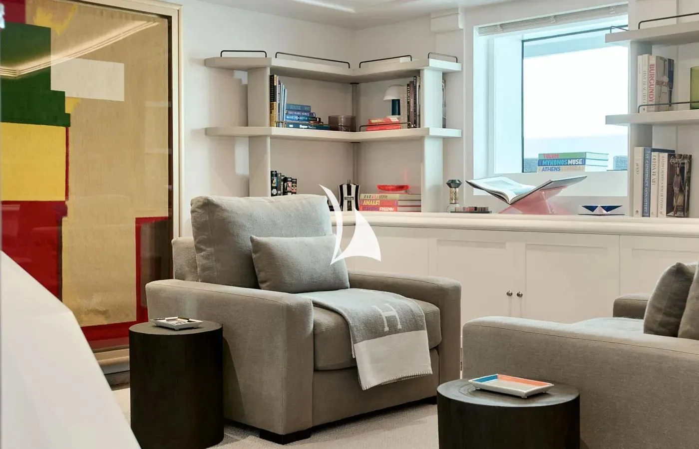 a living room with a couch and a window aboard ARBEMA Yacht for Sale