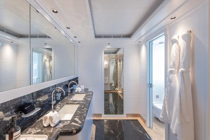a bathroom with a countertop sink and a large mirror aboard ARBEMA Yacht for Sale