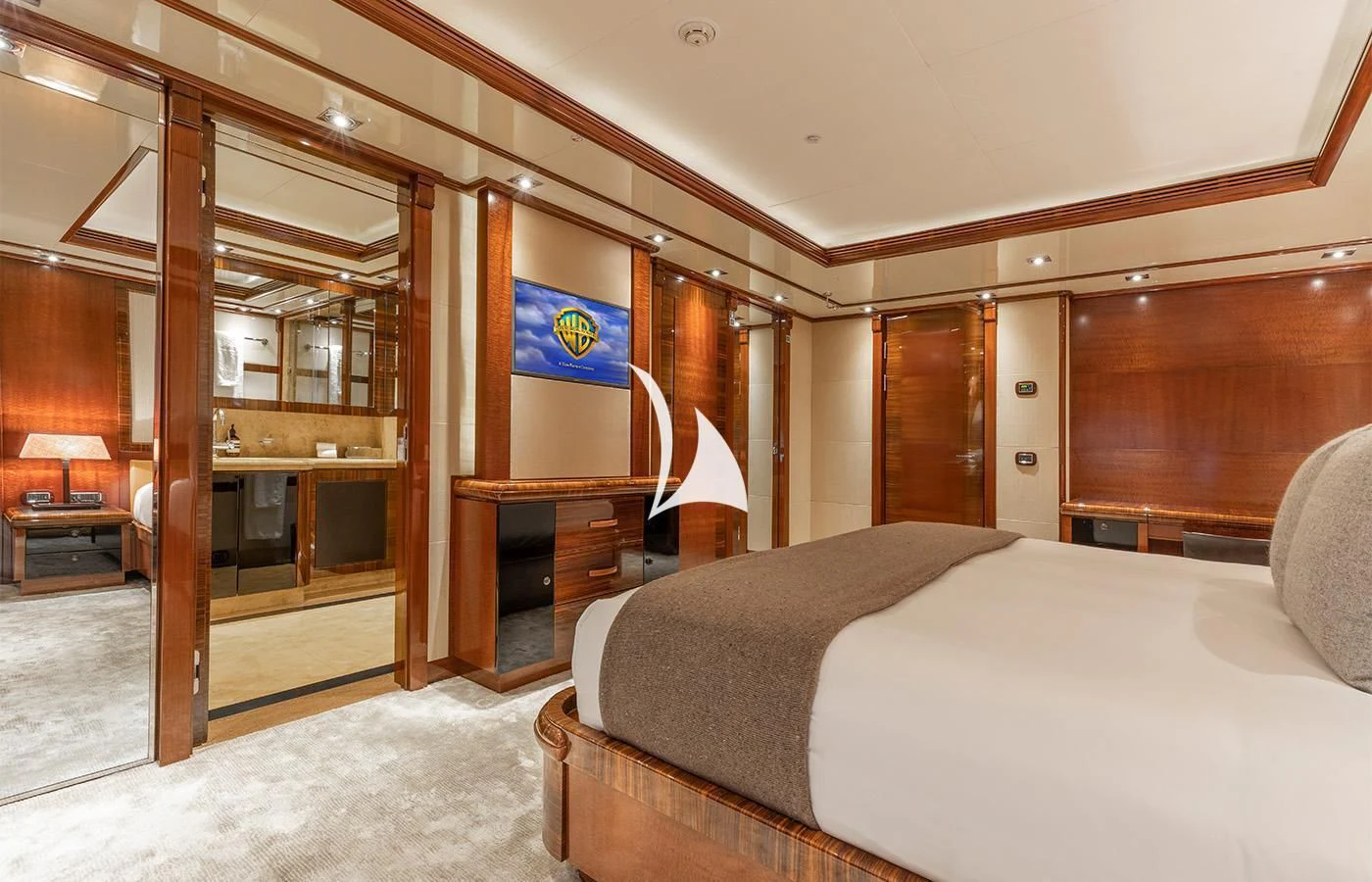 a bedroom with a bed and a closet aboard ARBEMA Yacht for Sale