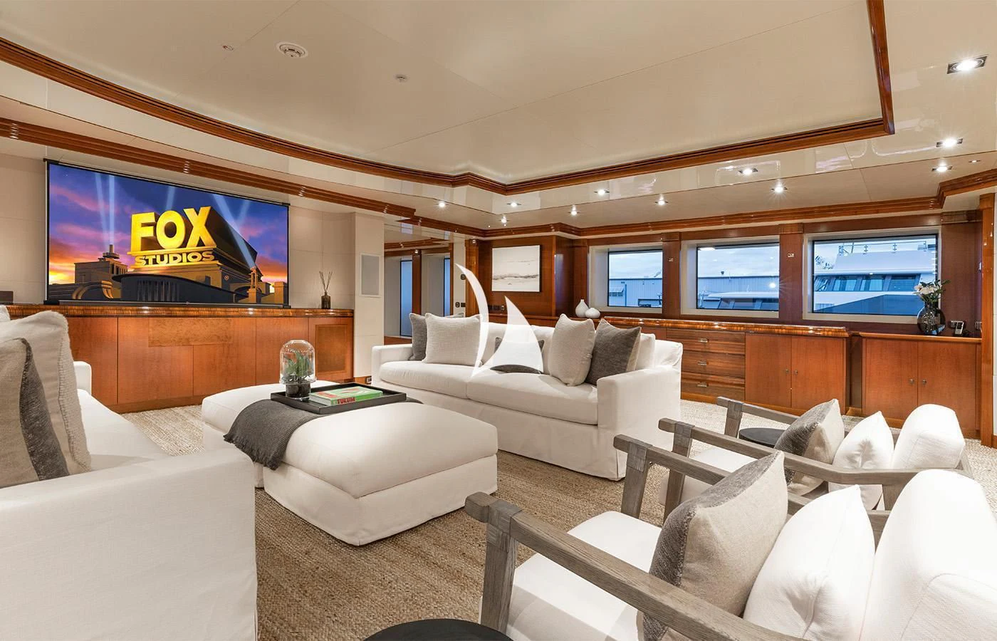 a room with couches and a tv aboard ARBEMA Yacht for Sale