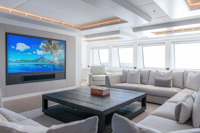 a living room with a large screen aboard ARBEMA Yacht for Sale