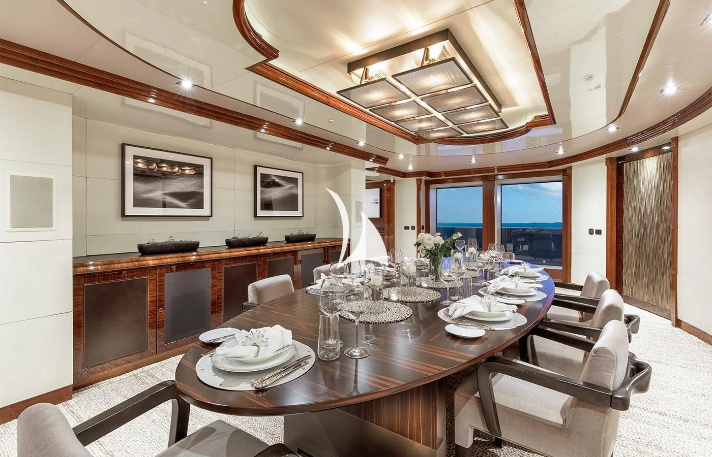 a large dining table in a room aboard ARBEMA Yacht for Sale