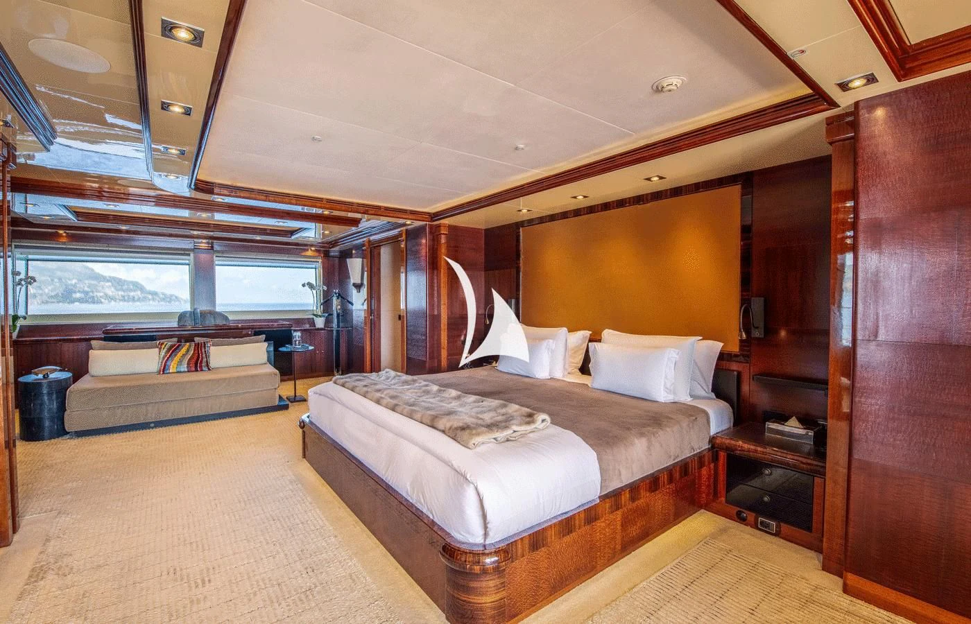 a room with a bed and a wood cabinet aboard ARBEMA Yacht for Sale