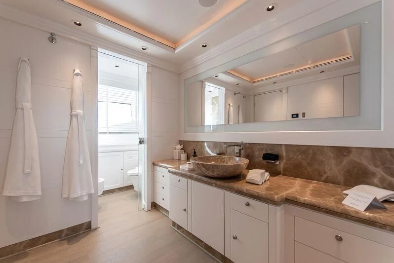 a kitchen with a countertop sink and cabinets aboard ARBEMA Yacht for Sale
