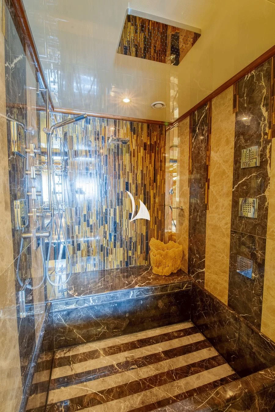 a bathroom with a glass shower aboard ARBEMA Yacht for Sale