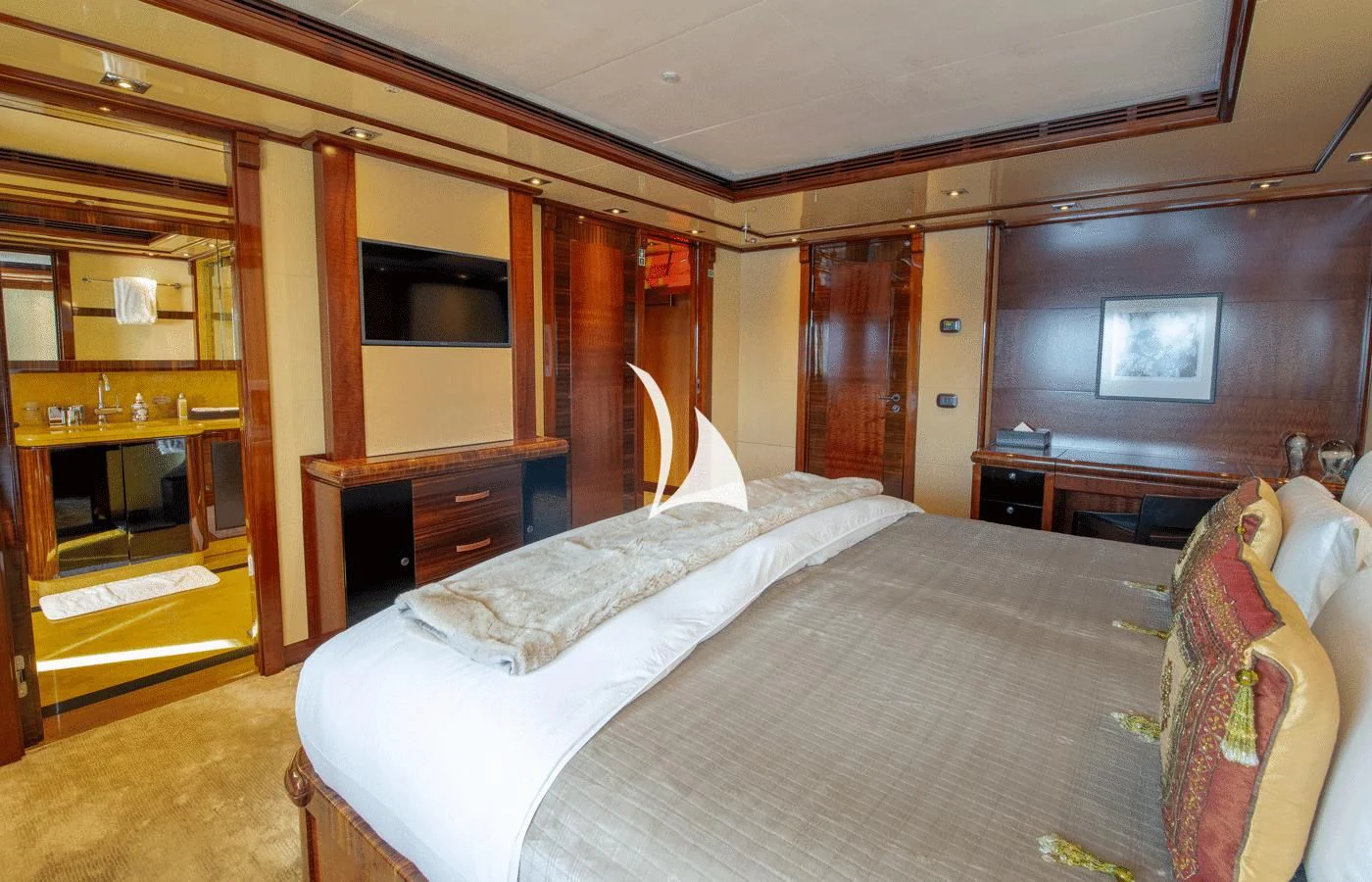 a bedroom with a bed and a television aboard ARBEMA Yacht for Sale