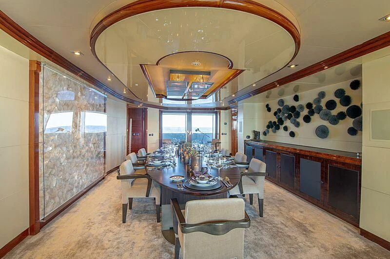 a large room with a table and chairs aboard ARBEMA Yacht for Sale