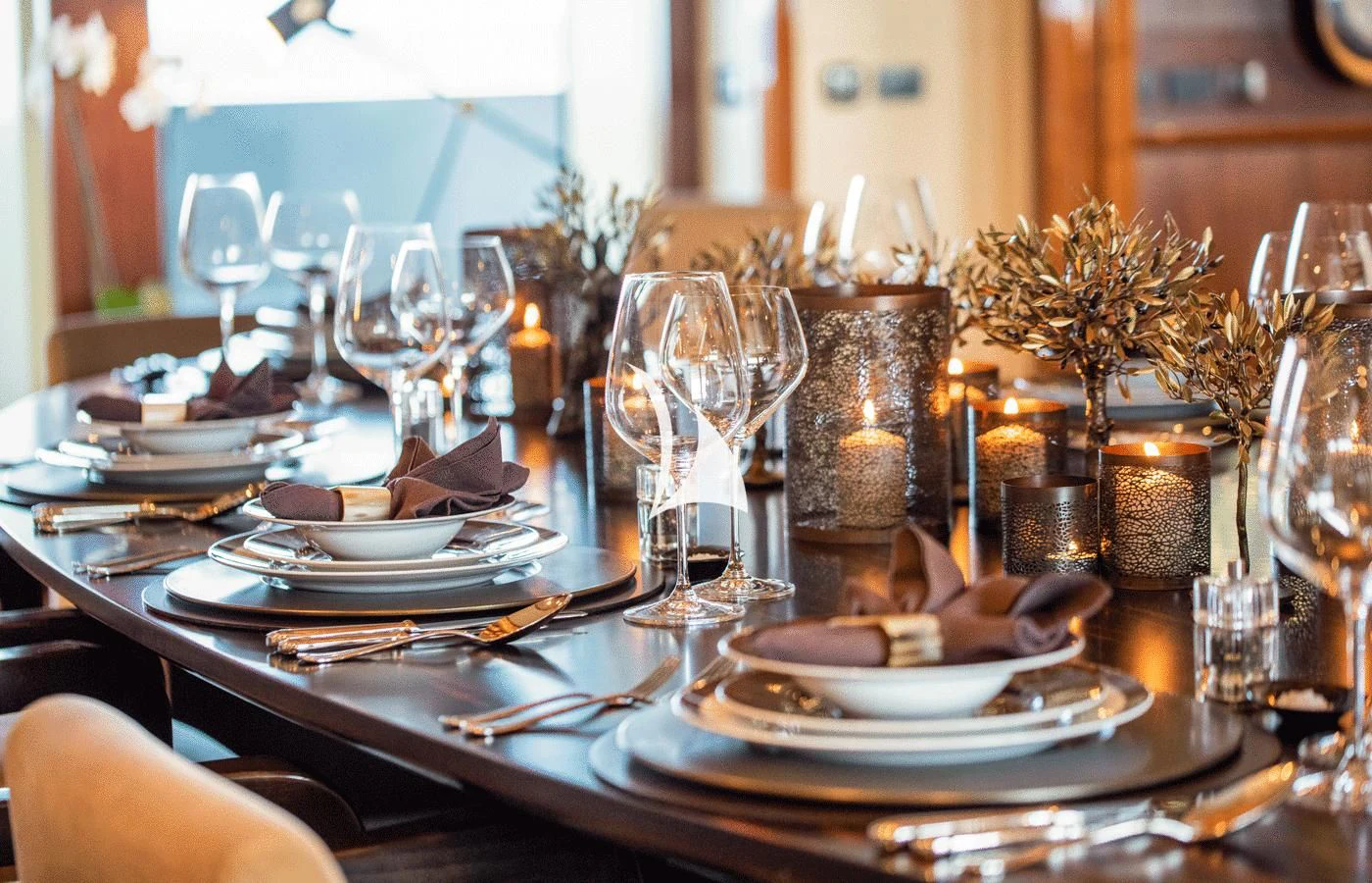 a table with plates and glasses aboard ARBEMA Yacht for Sale