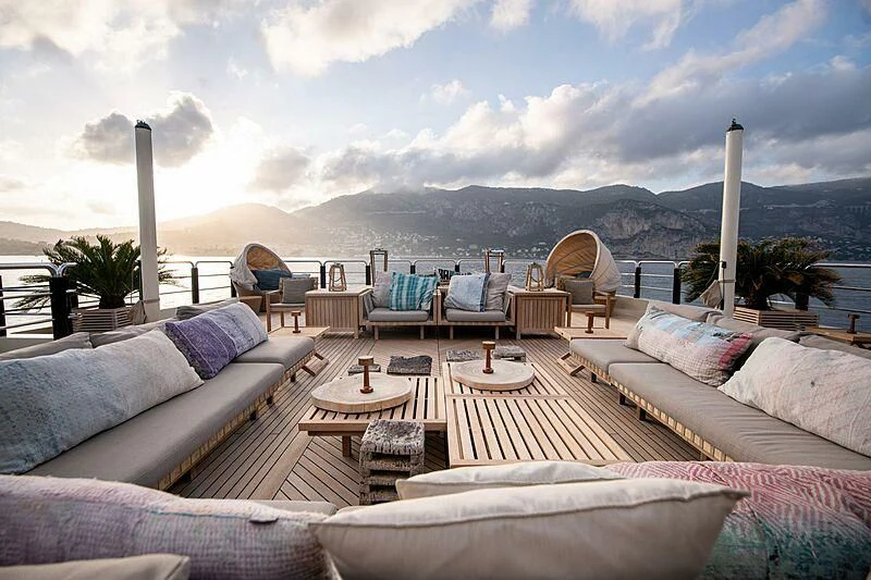 a patio with a table and chairs aboard ARBEMA Yacht for Sale