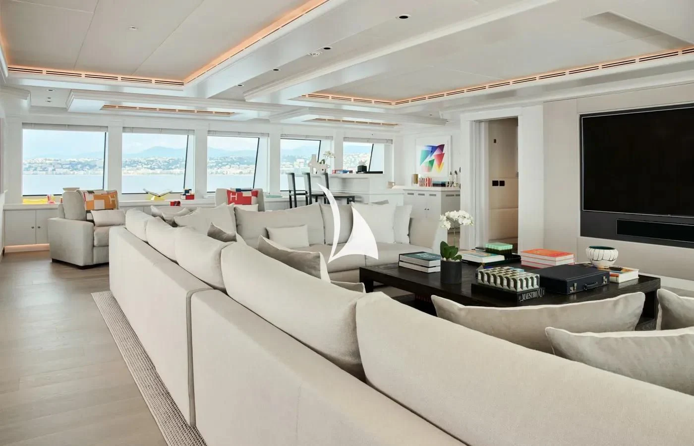 a living room with a large screen aboard ARBEMA Yacht for Sale