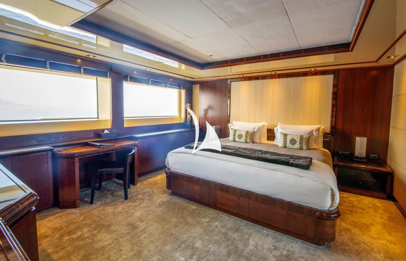 a bedroom with a bed and desk aboard ARBEMA Yacht for Sale