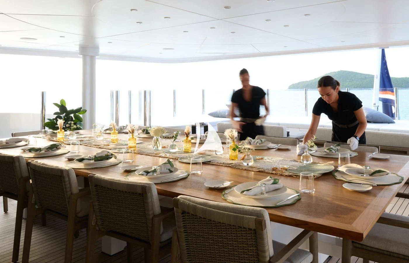 a couple of men at a table aboard ARBEMA Yacht for Sale