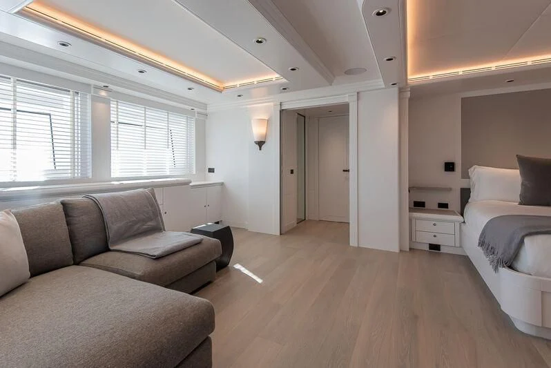 a living room with a couch and a window aboard ARBEMA Yacht for Sale