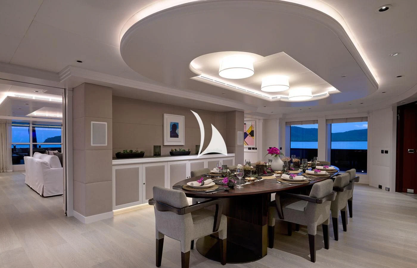 a large room with a table and chairs aboard ARBEMA Yacht for Sale