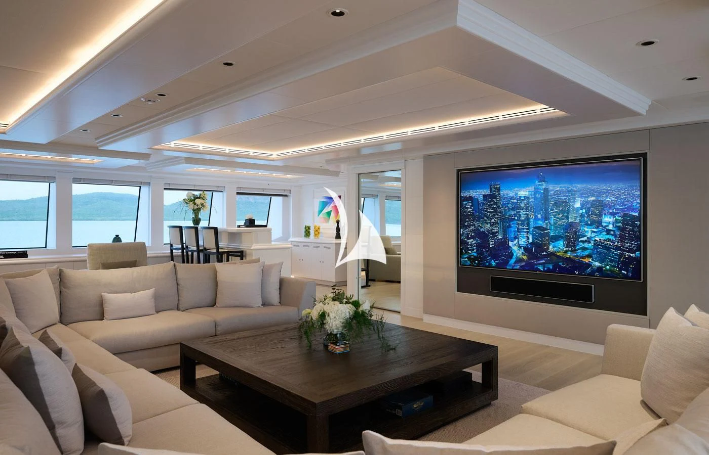 a living room with a large screen aboard ARBEMA Yacht for Sale