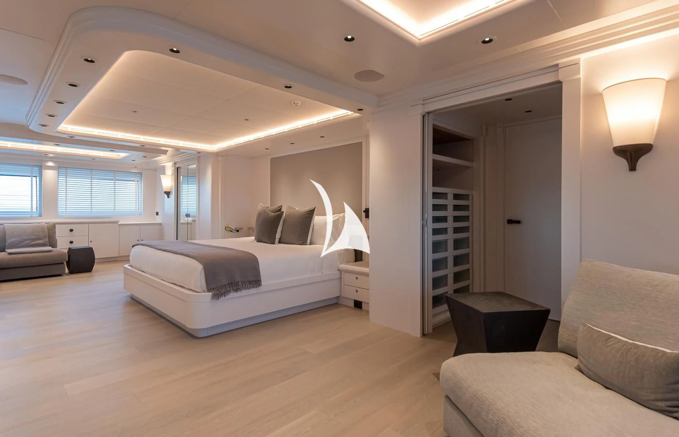 a bedroom with a bed and a couch aboard ARBEMA Yacht for Sale