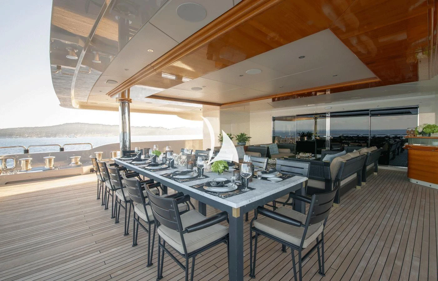 a large room with a table and chairs aboard ARBEMA Yacht for Sale