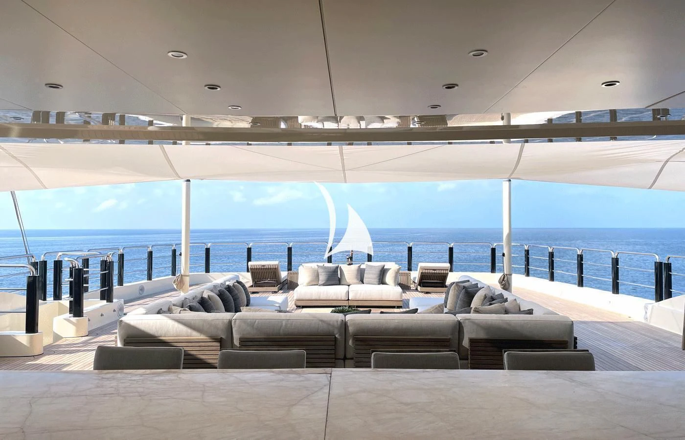 a large lounge area with a large pool and a large deck aboard ARBEMA Yacht for Sale