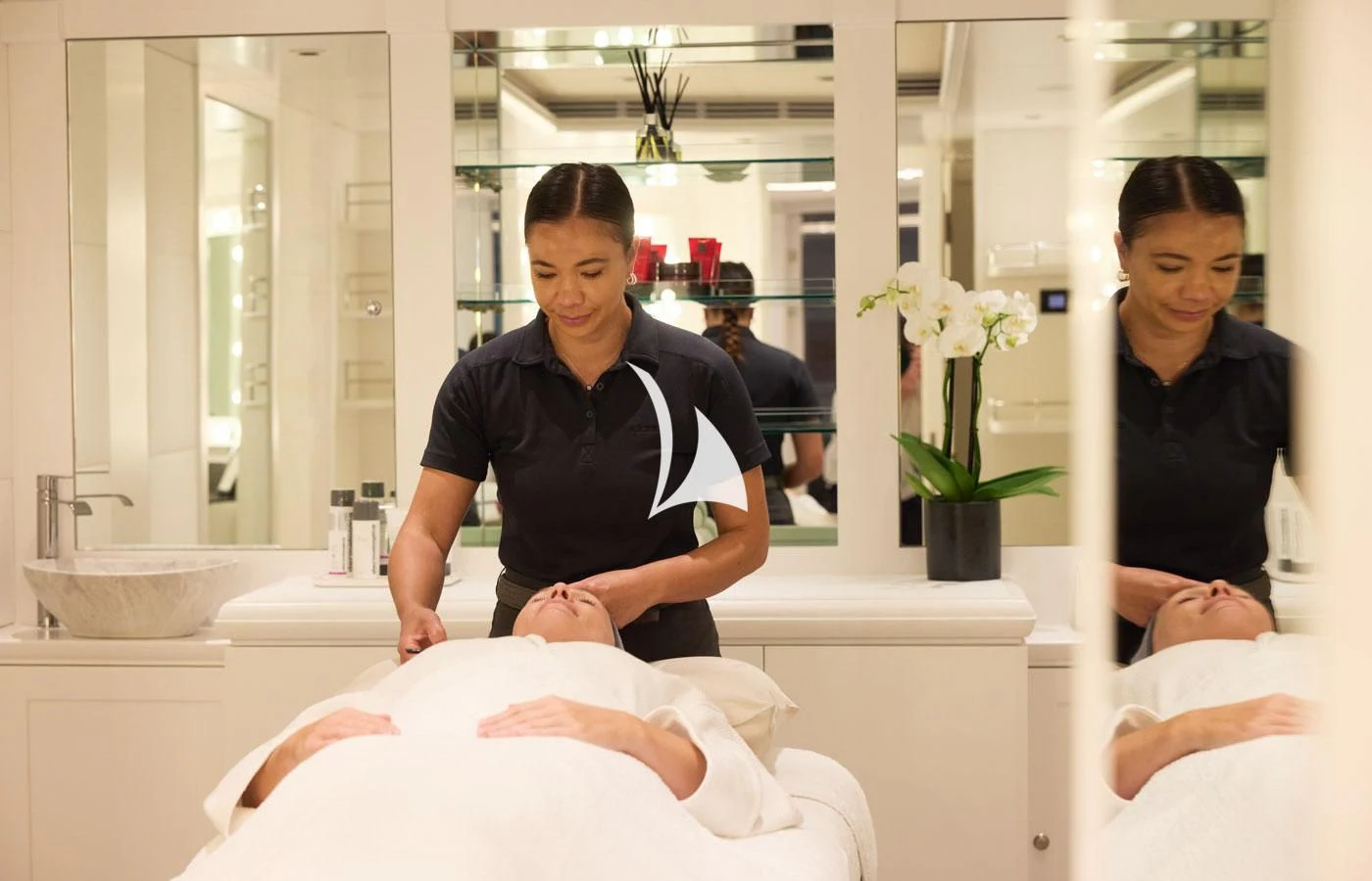 a woman sitting on a bathtub with a man standing in the background aboard ARBEMA Yacht for Sale