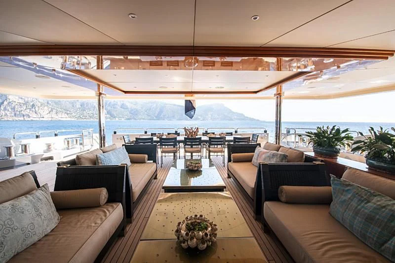 a living room with a large patio aboard ARBEMA Yacht for Sale