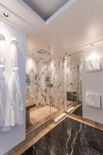 a bathroom with a large mirror aboard ARBEMA Yacht for Sale