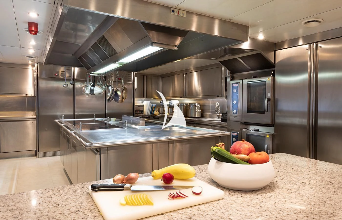 a kitchen with stainless steel appliances aboard ARBEMA Yacht for Sale