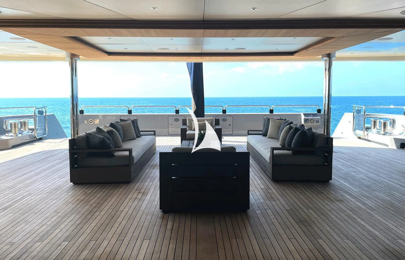a large living room with a large blue ocean aboard ARBEMA Yacht for Sale
