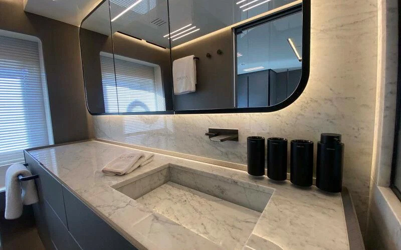 a bathroom with a large mirror aboard AMORES Yacht for Sale
