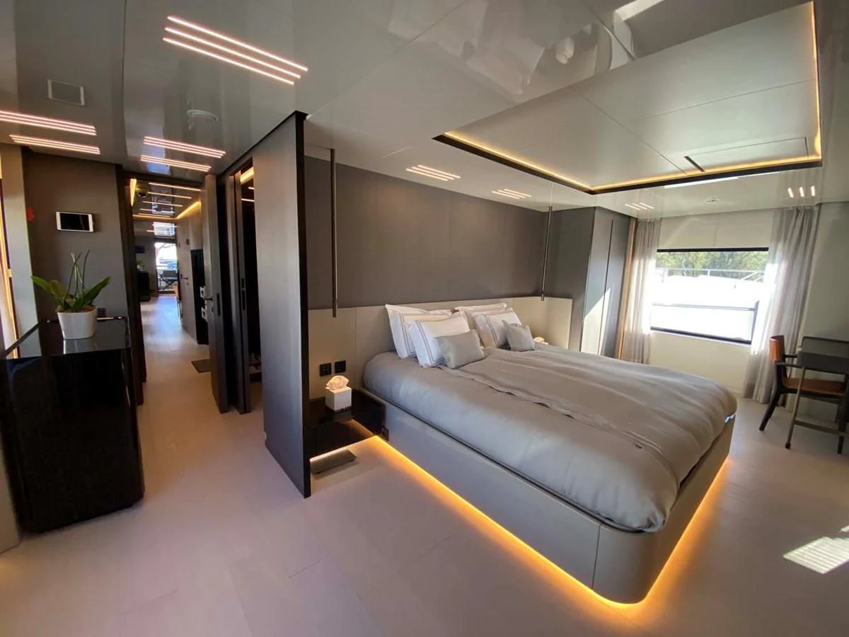 a room with a couch and a table aboard AMORES Yacht for Sale