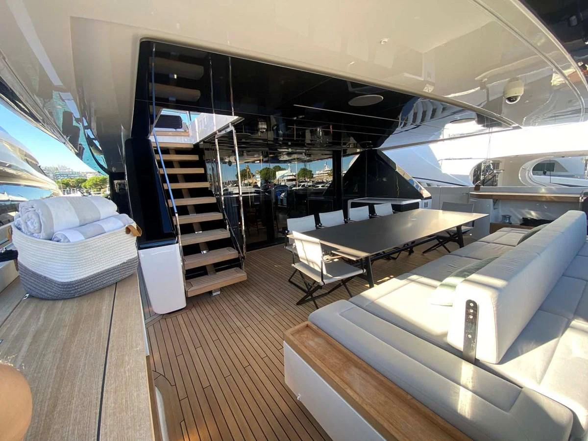 a large room with a large metal bar and a staircase aboard AMORES Yacht for Sale