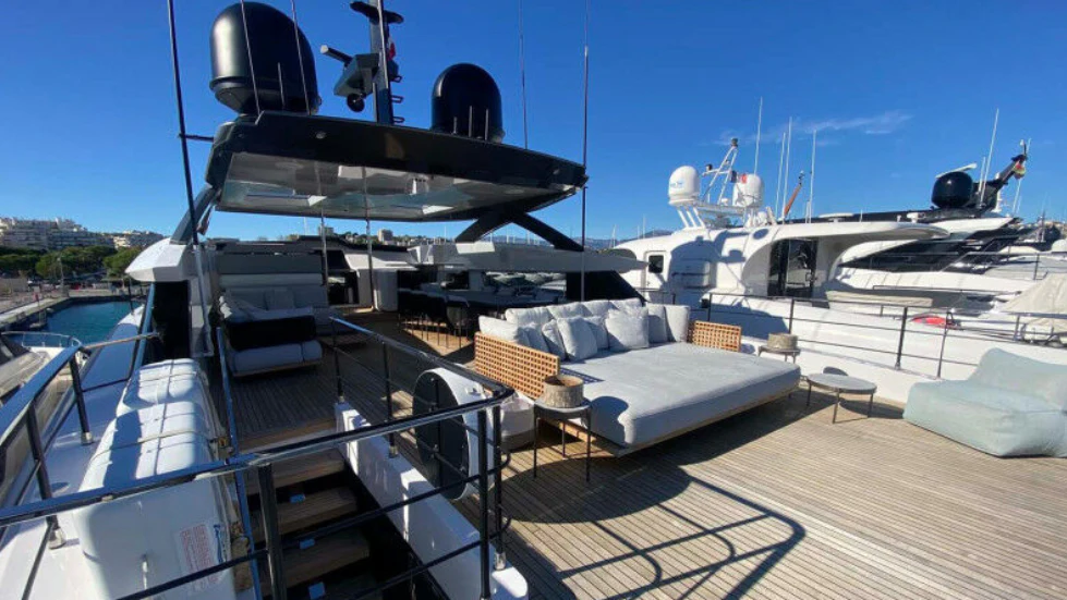 a large black ship docked aboard AMORES Yacht for Sale