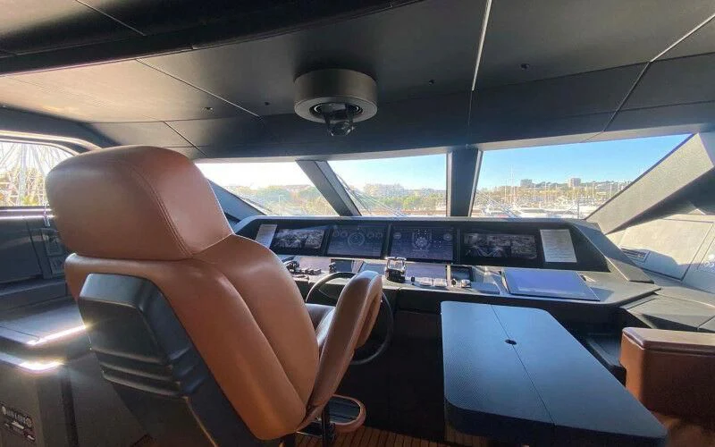 a person sitting in a car aboard AMORES Yacht for Sale