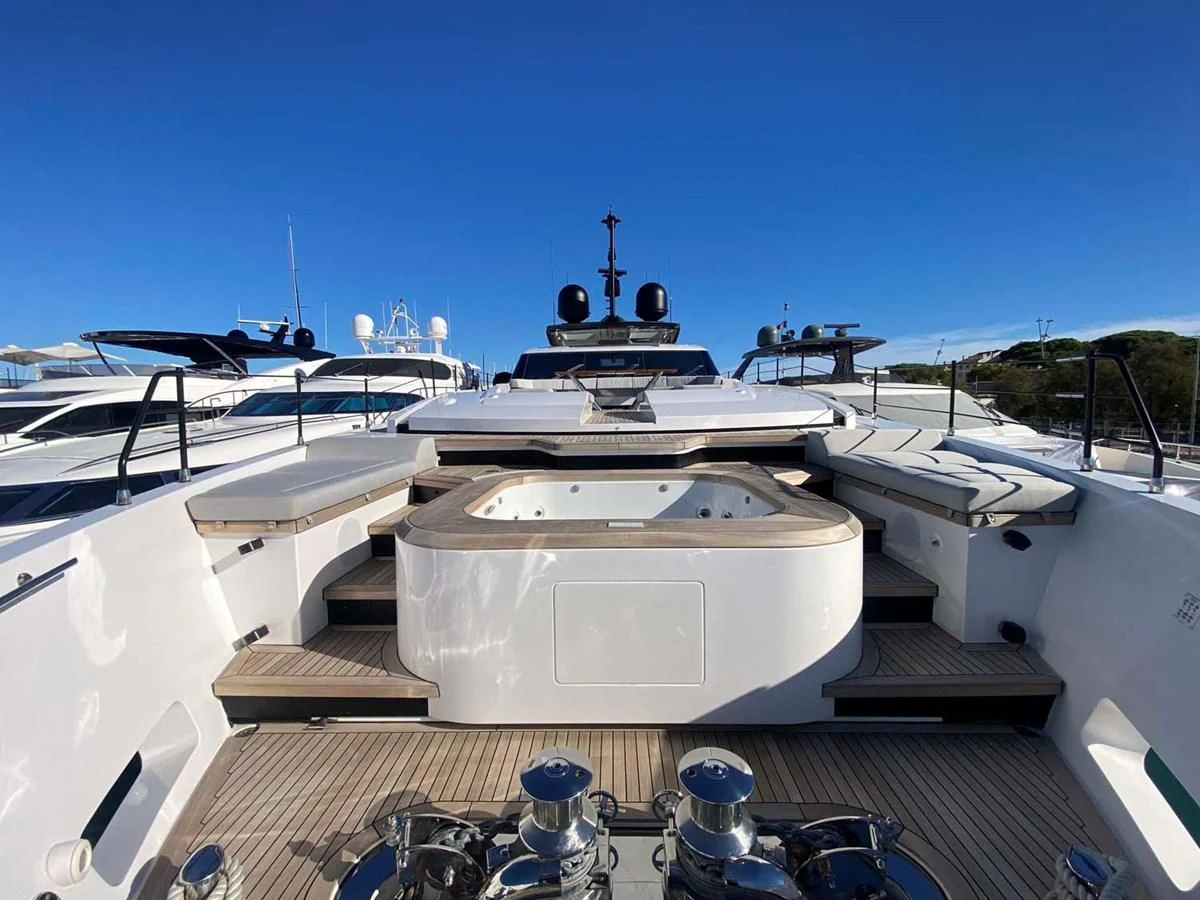 a large white ship with a black and white surface aboard AMORES Yacht for Sale
