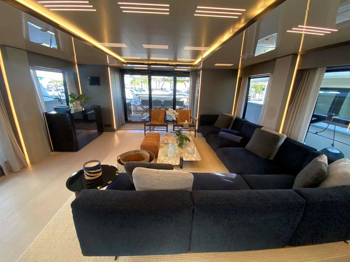a living room with a large window aboard AMORES Yacht for Sale