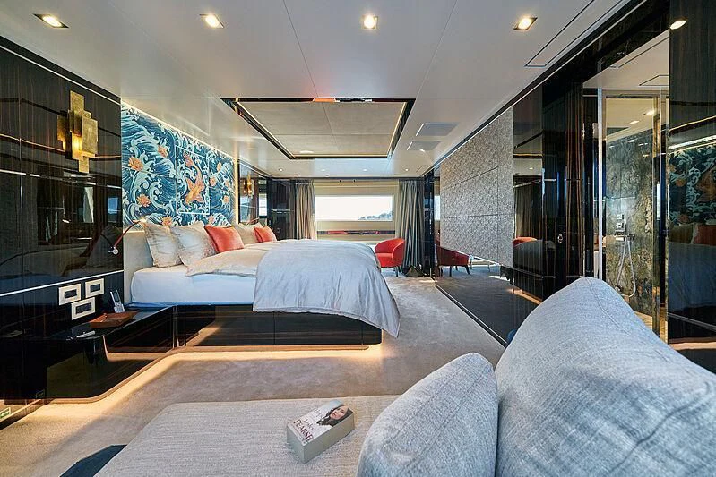 a bedroom with a bed and a couch aboard HAPPY ME Yacht for Charter