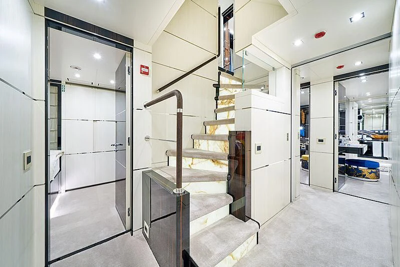 a long hallway with a staircase aboard HAPPY ME Yacht for Charter