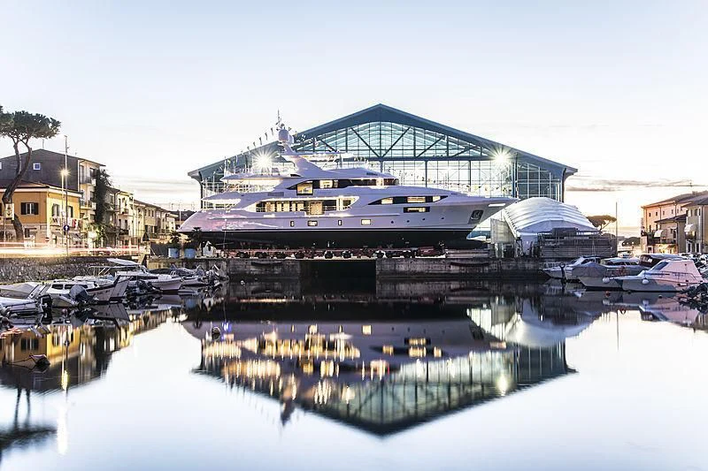 a large boat in a harbor aboard HAPPY ME Yacht for Charter