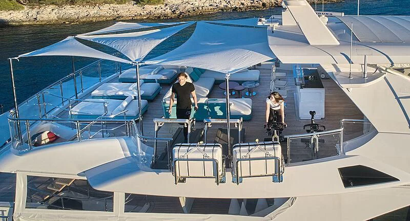 a couple of people on a boat aboard HAPPY ME Yacht for Charter