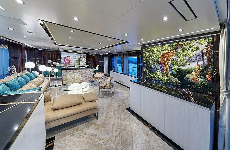 a living room with a large screen aboard HAPPY ME Yacht for Charter