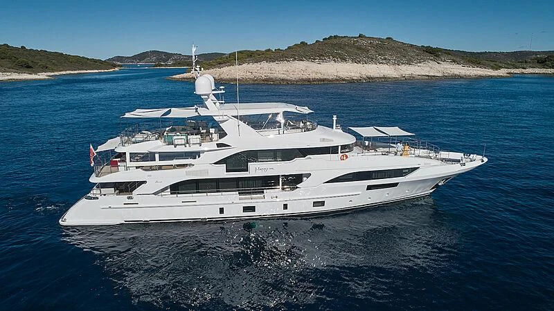 a large white yacht in the water aboard HAPPY ME Yacht for Charter