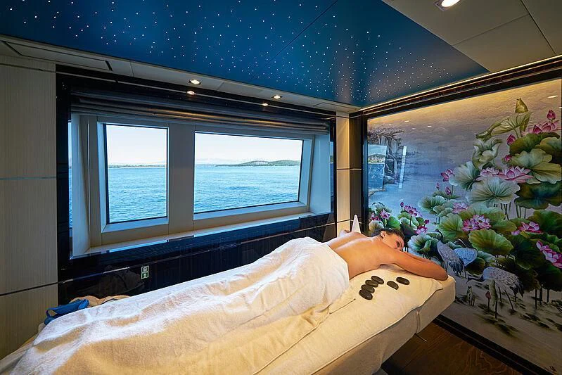 a person lying in a bed aboard HAPPY ME Yacht for Charter