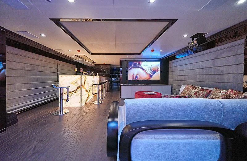 a room with a couch and a tv aboard HAPPY ME Yacht for Charter