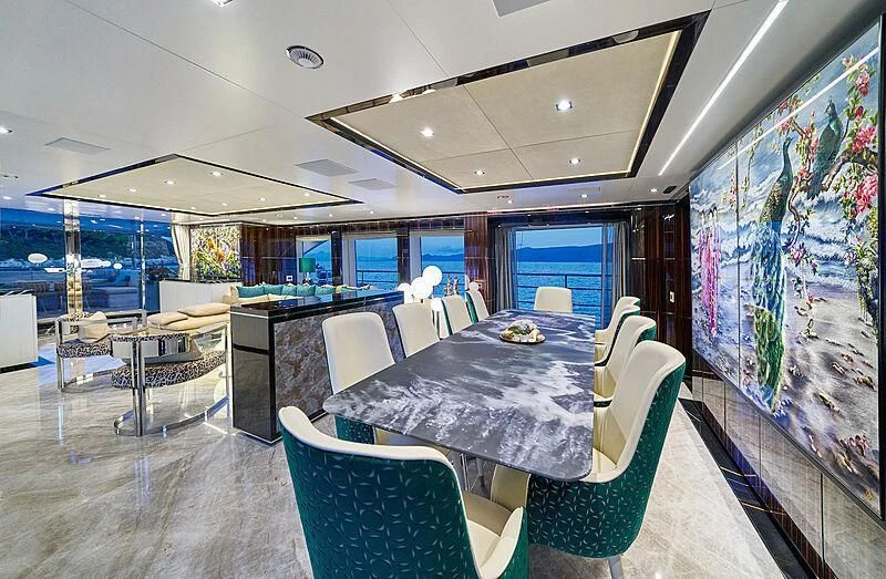 a room with a table and chairs aboard HAPPY ME Yacht for Charter