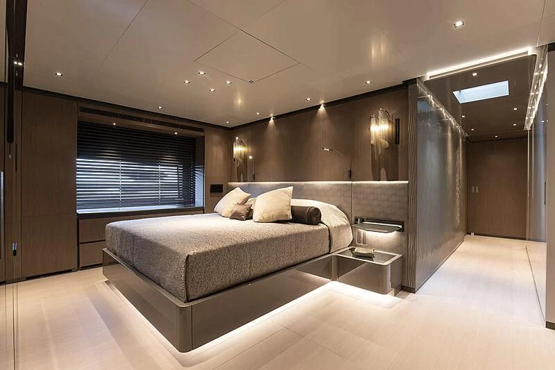 a large bedroom with a large bed aboard PANAM Yacht for Sale