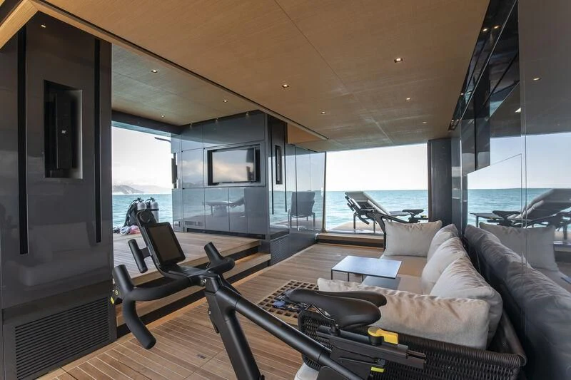 a living room with a large window aboard PANAM Yacht for Sale