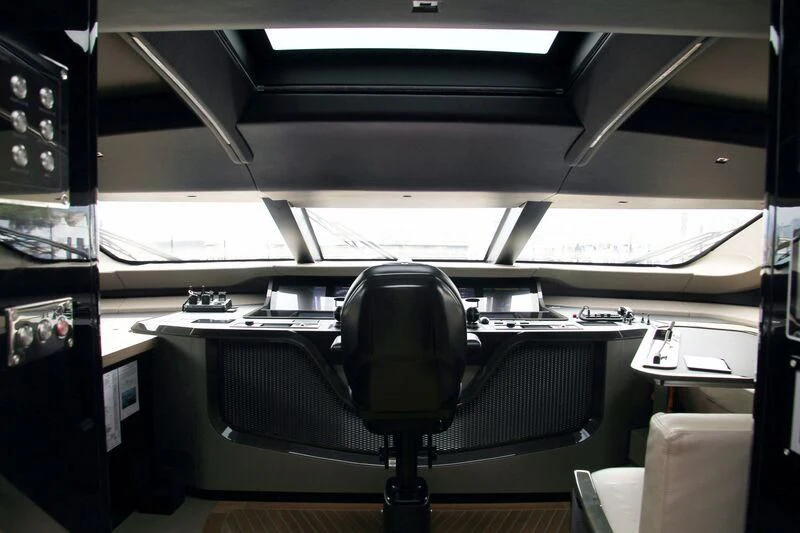 a black chair in a room aboard PANAM Yacht for Sale